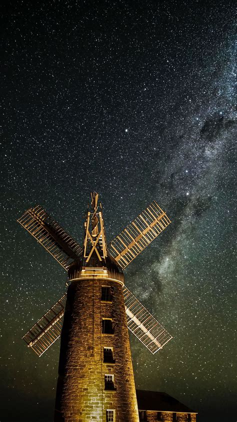 Download Wallpaper 1080x1920 Windmill Tower Building Night Starry