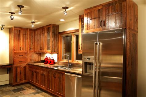 The wood was used for decades, and often shows some of the signs of its cutting, nailing, and regular use. Barnwood Kitchen Cabinets & Bars