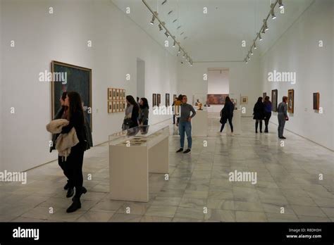 Visitors Stand In An Exhibition Room Museo Nacional Centro De Arte Reina Sof A Madrid Spain