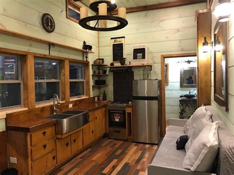 We loved touring this 30 foot long and 8 5 foot wide tiny house on wheels it has a layout that we feel is very functional with a large relatively speaking living room and sofa bed 2 sitting. TINY HOUSE TOWN: 32' Modern Rustic Tiny Home