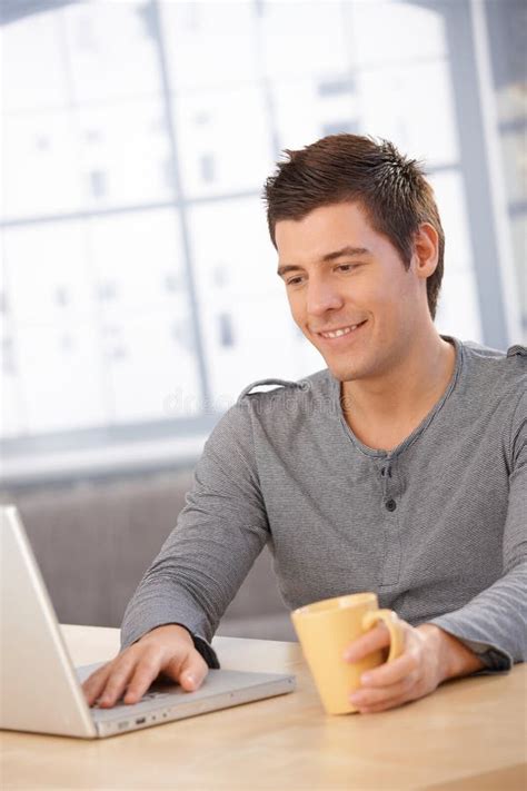 Smiling Guy Using Laptop Computer Stock Photo Image Of Adult Indoors