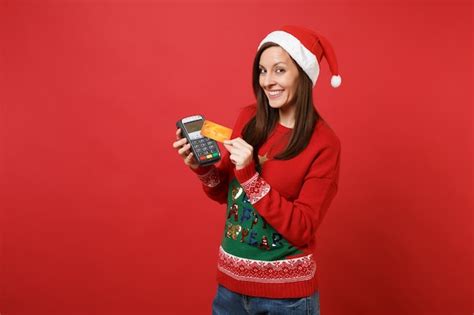 Premium Photo Attractive Santa Girl Holding Wireless Modern Bank Payment Terminal To Process