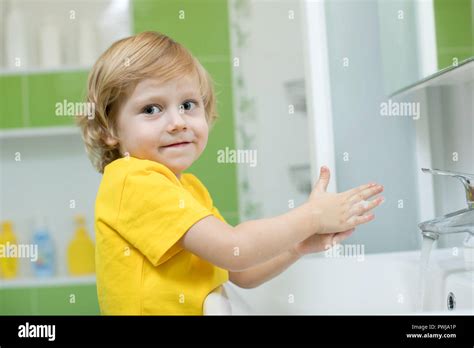 Little Child Boy In A Bathroom Washing Hand With Soap Stock Photo Alamy
