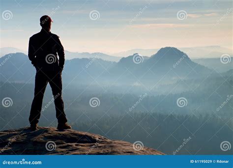 Hiker On Sandstone Rock In Rock Empires Park And Watching Over The