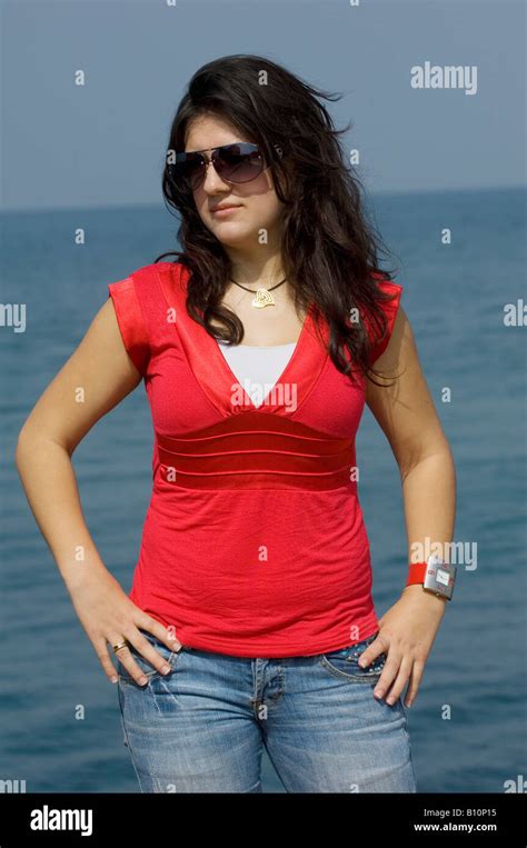 Beautiful Young Middle Eastern Woman Standing By The Sea Hands On Waist