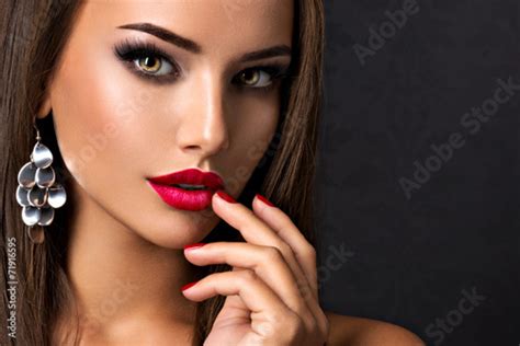 Seductive Woman With Dark Brown Eye Makeup And Bright Red Lips A