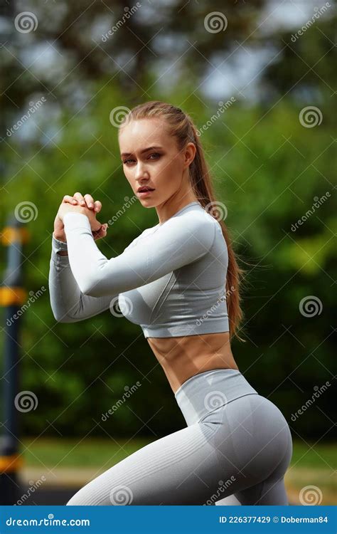 Young Sporty Woman Doing Exercises With Rubber Band Outdoor Stock Image Image Of Beautiful