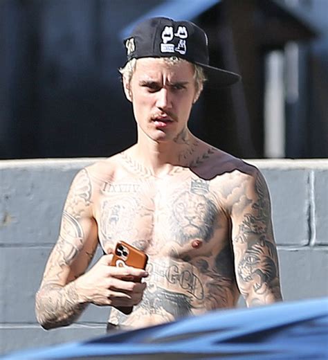 justin bieber s body tattoos photos of the biebs famous ink hollywood life