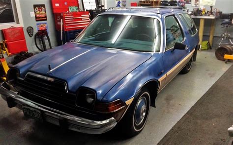 The car is a 1978 or 1979 amc pacer station wagon with indiana plates: Wacky Wagon: 1979 AMC Pacer DL