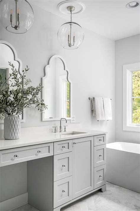 From hollywood vanity mirrors with lights to wood farmhouse wall mirrors, there is a mirror to refresh every vanity mirror table: Glass lights over a light gray dual washstand highlight a ...