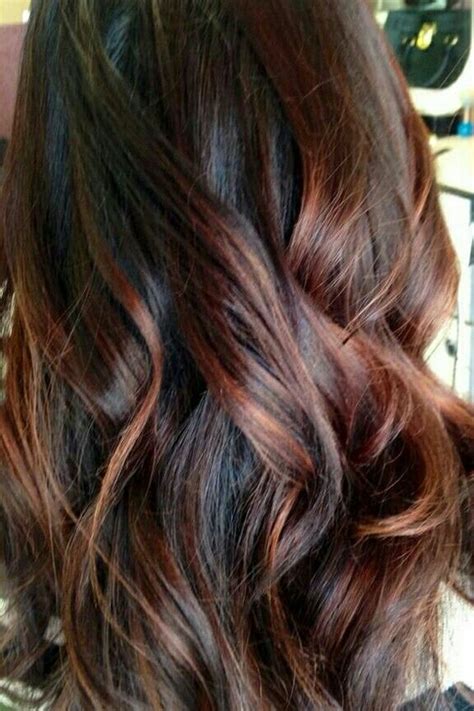 The red bangs looks beautiful when paired with the lighter highlights on the ends of her hair. 30 Natural And Rich Brown Hair Ideas - Styleoholic