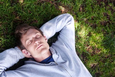 Young Man Sleeping In The Grass Stock Photo Image Of Sleeping Lawn