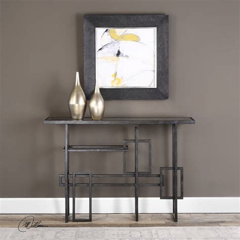 When styling a glass and chrome console table, you'll want to make sure that these clear, shiny, metallic materials are able to speak for themselves. Uttermost Dane Industrial Console Table UTTERMOST-24690 at ...