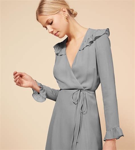 ricki dress 218 00 usd reformation this is a mini length wrap dress with a ruffle