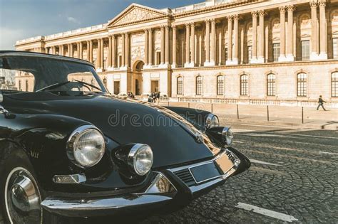 Beautiful Black Vintage Car Parked In Front Of The Louvre Museum Paris