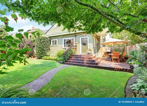 Backyard Area With Walkout Deck And Well Kept Lawn Stock Photo Image