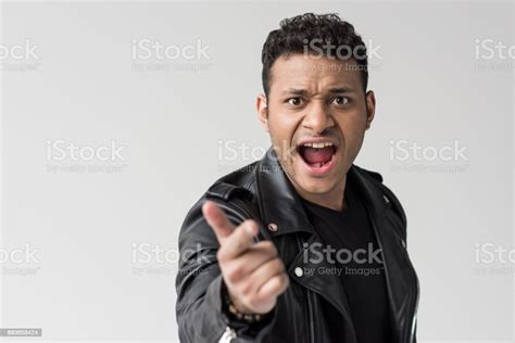 Portrait Of Angry African American Man Yelling And Pointing Isolated On