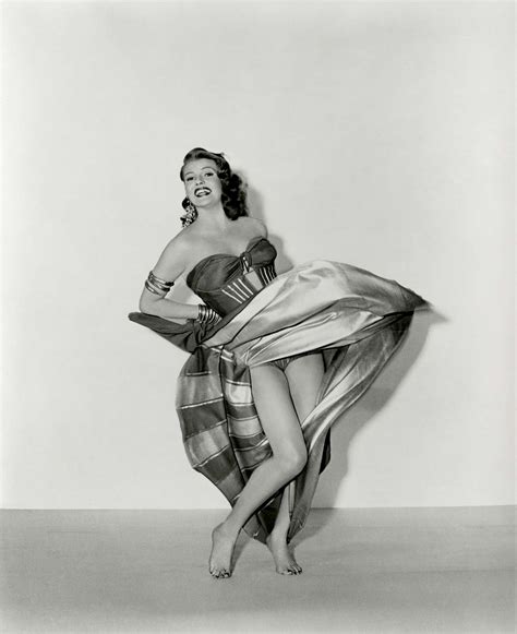 Unveiling The Iconic Pin Up The Story Behind Rita Hayworths 1941 Photo