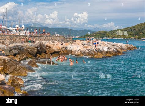 Teenagers And Young People Swimming In The Harbour Of Portovenere