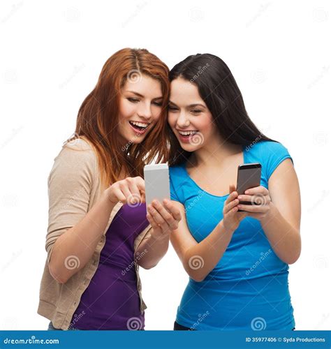 Two Smiling Teenagers With Smartphones Stock Photo Image Of Cell