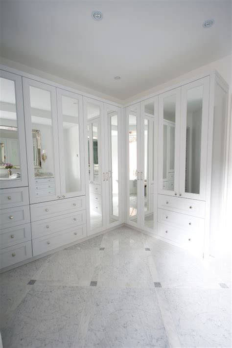 This allows the space to feel airier and even bigger—not to mention, the transparency forces you to stay organized. Mirrored Closets - Transitional - closet - Meredith Heron ...