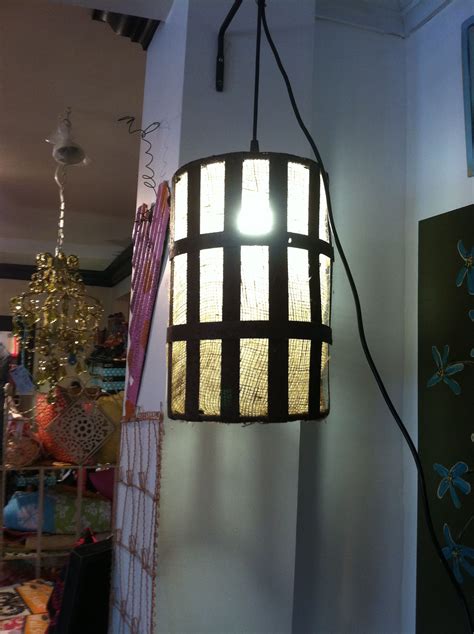 A dropped ceiling is a secondary ceiling, hung below the main (structural) ceiling. metal light wrapped in burlap | Metal lighting, Ceiling ...
