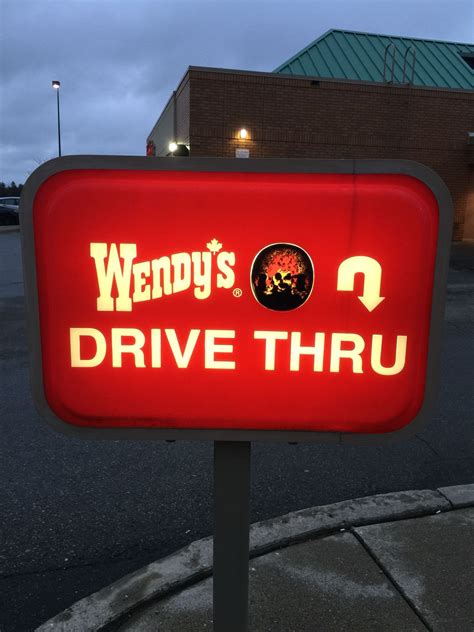 This Warn Out Picture Of Wendy On The Wendys Drive Thru Sign