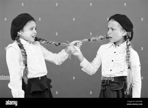 School bullies. Bully girls on pink background. Bully classmates