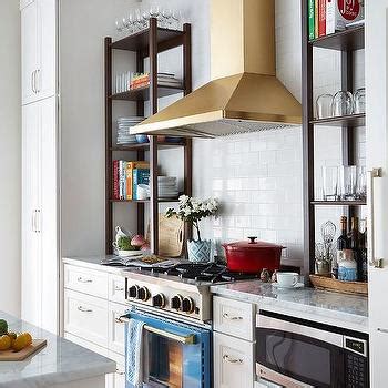 Small kitchens with white cabinets can help your space look bigger, and brighter, which can enhance the entire atmosphere of your room. Gold Lanterns Over Carrera Marble Top Island ...