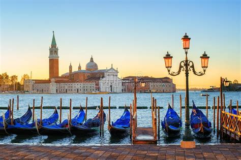 Gondolas And San Giorgio Maggiore Island Venice Italy Stock Photo