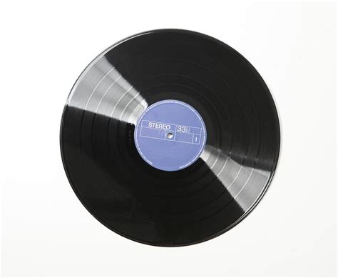 Vinyl Record On White Background By Vincenzo Lombardo
