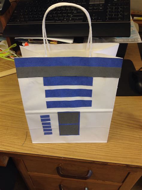 If you want to make a star wars themed birthday or holiday themed gift, why, you've got lots to choose from here! Homemade Star Wars gift bag made by moi. R2D2 | Star wars gift bags, Star wars gift basket, Star ...