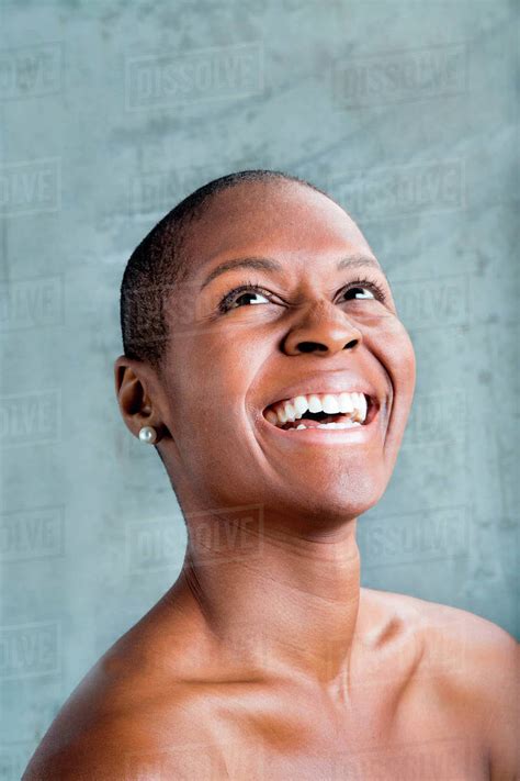 Portrait Of Smiling Black Woman Looking Up Stock Photo Dissolve