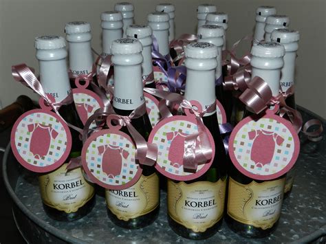 A baby shower is such an exciting moment in the journey of welcoming a new child into this world. Couples baby shower favors - tag on the back says "When Mom, Dad, and Baby make three, r ...