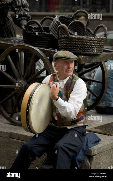 Street Musician Playing The Traditional Irish Bodhran Instrument Stock
