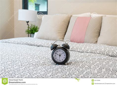 Close Up Of Alarm Clock On Bed Stock Photo Image Of Bedside Alarm