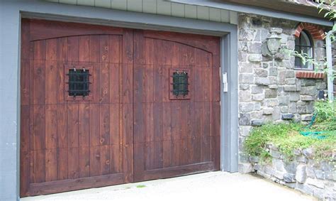 These doors look like they swing open from the middle to allow you a grand entrance into your garage, but they actually open like a traditional garage door. Carriage Garage Doors | Carraige Doors | Custom Carriage ...