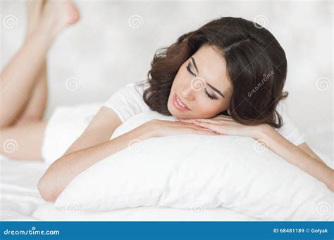 Young Woman Wakes Up In A White Bed In The Morning Stock Image Image