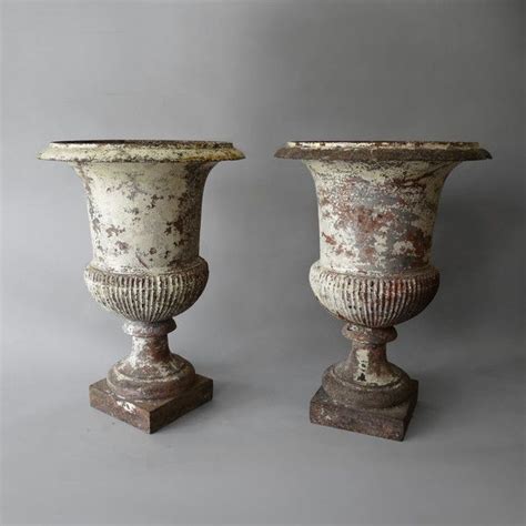A Pair Of Painted Iron Urns Antique Urn Urn Antiques