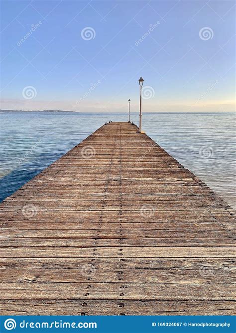A Wooden Jetty Boardwalk Leading Out To Sea Stock Image Image Of Edge
