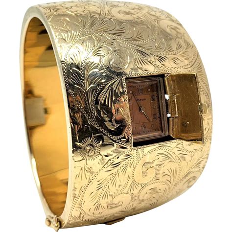 Title 14k Gold Ladies Wide Hinged Bangle Hidden Marvin Watch 98g