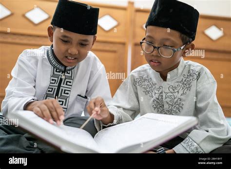 Kid Muslim Reading Quran In The Mosque During Ramadan Stock Photo Alamy