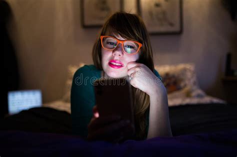Cute Girl With Glasses Looking At Her Phone Stock Image Image Of Girl