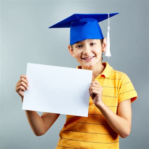 Proud Child Holding A Blank Paper Photo Free Download