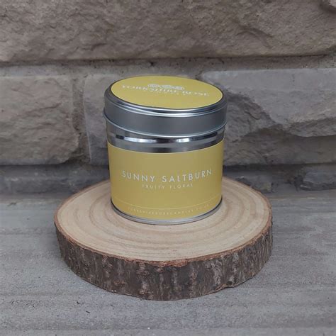 sunny saltburn scented tin candle