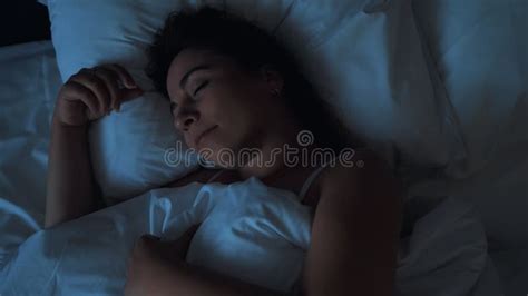 Young Woman Sleeps In Bed Top View Close Up Resting And Relax Concept