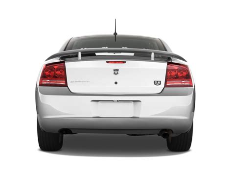 We analyze millions of used cars daily. Image: 2010 Dodge Charger 4-door Sedan SXT RWD Rear ...
