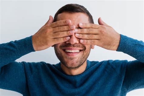 Free Photo Man Covering Both Eyes With Hands