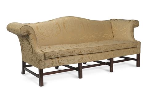 A Pair Of Camelback Upholstered Mahogany Framed Sofas In The George Ii