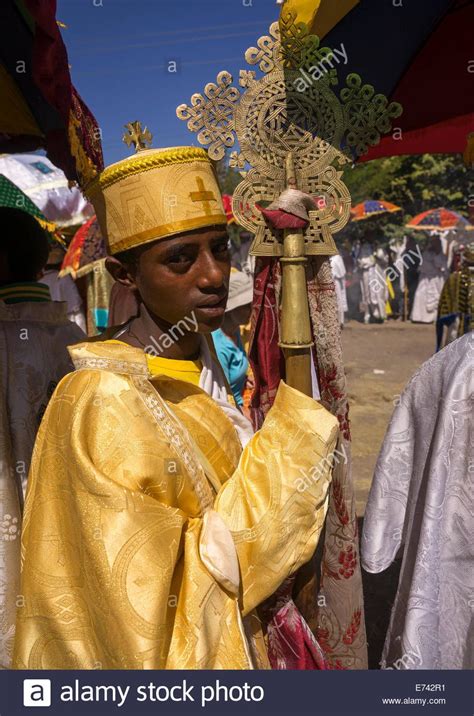 Ethiopian Orthodox Priest Holding A Cross During The Colorful Timkat